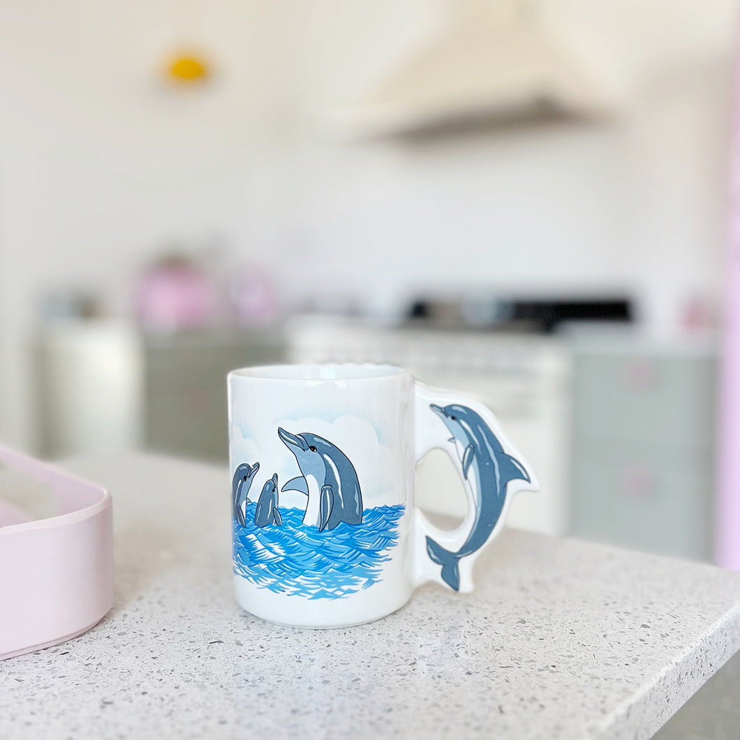 Vintage dolphin handle mug